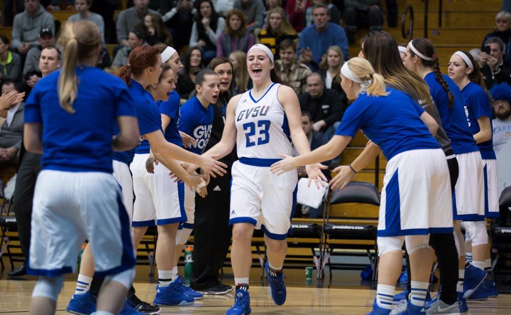 GVL / Kevin Sielaff - Kayla Dawson (23) runs onto the court at the start of the match.  The Lakers down the Timberwolves of Northwood University in Allendale with a final score of 71-47 Jan. 24, 2016.