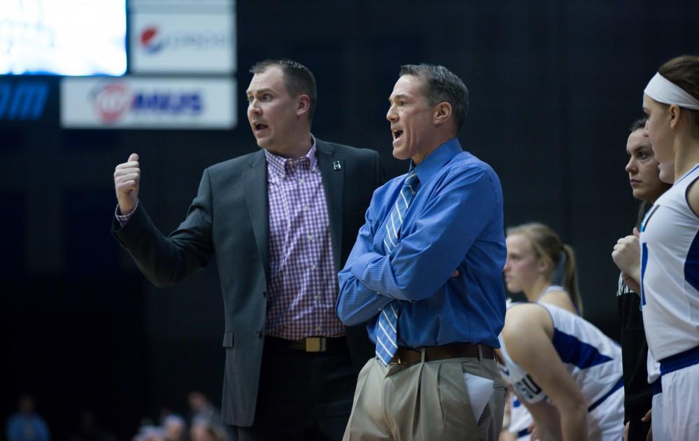 GVL / Kevin Sielaff - Head coach Mike Williams and associate head coach Phil Sayers speak to one another.  The Lakers down the Timberwolves of Northwood University in Allendale with a final score of 71-47 Jan. 24, 2016.