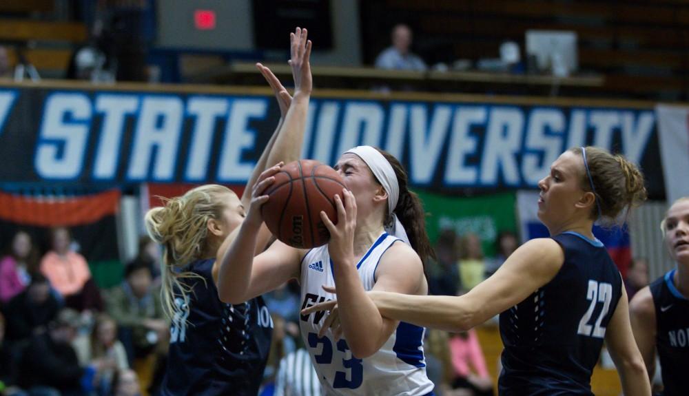 GVL / Kevin Sielaff - Kayla Dawson (23) is hacked on her way to the rim.  The Lakers down the Timberwolves of Northwood University in Allendale with a final score of 71-47 Jan. 24, 2016.