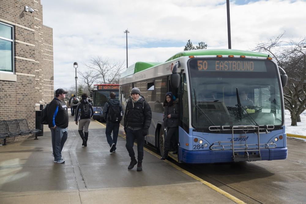 GVL / Luke Holmes - Grand Valley students exit the 50 bus at the Kirkhof Center Wednesday, Feb. 17, 2016.