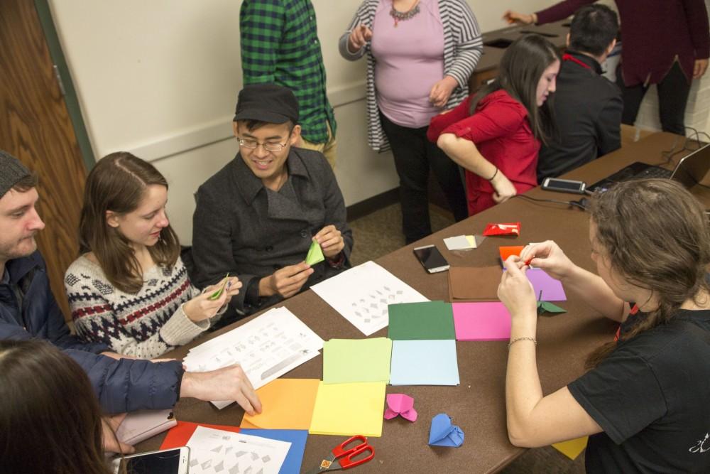 GVL / Sara Carte
Grand Valley State University students make origami during the celebration of the Asian New Year Festival 2016, sponsored by the Asian Student Union and the Office of Multicultural Affaris, in the Kirkhof Center on Thursday, Feb. 4, 2016.