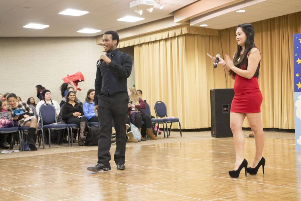 GVL / Sara Carte
Marcus Jiles (left) and Leah Taylor (right) hosts Grand Valley State University’s celebration of the Asian New Year Festival 2016, sponsored by the Asian Student Union and the Office of Multicultural Affaris, in the Kirkhof Center on Thursday, Feb. 4, 2016.