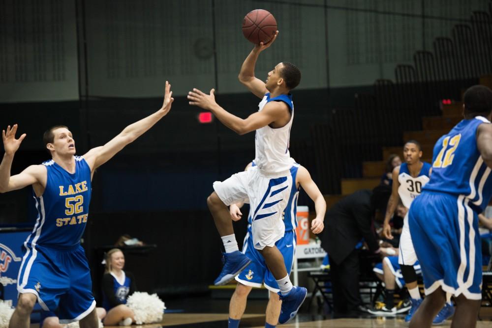 GVL / Luke Holmes - Myles Miller (12) jumps up for the shot. Grand Valley had a victory over Lake Superior State Thursday, Feb. 12, 2016.