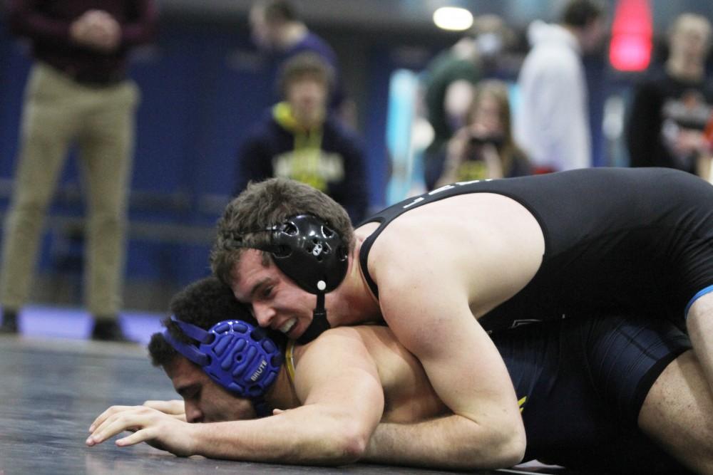 Eric Dietz pins his opponent in the club wrestling match on Feb. 6 in Allendale, MI. 