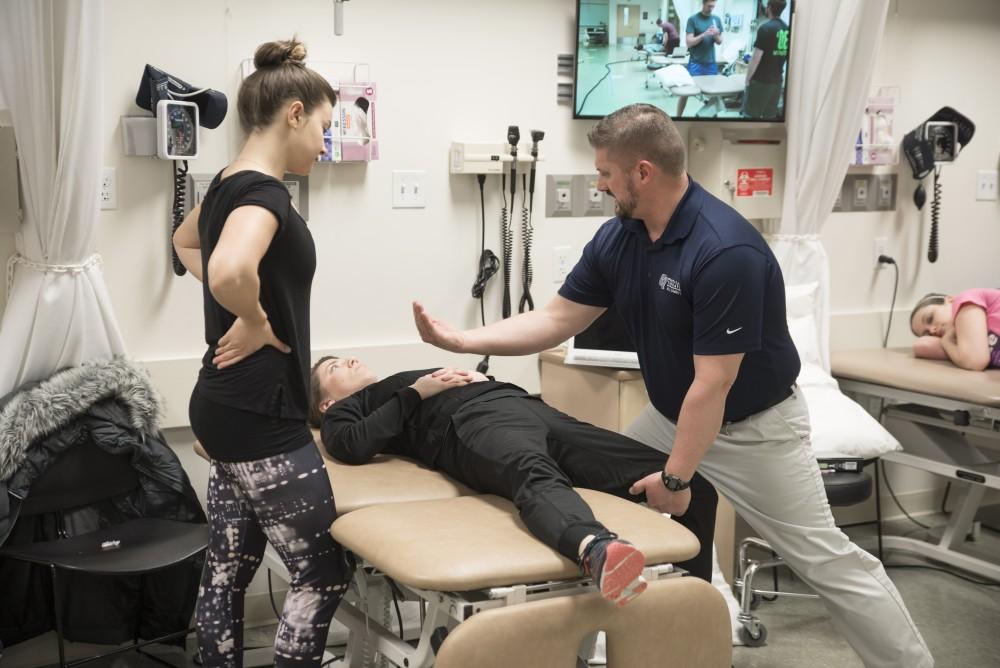 GVL / Luke Holmes
Corey Sobeck, Assistant Professor, helps demonstrate proper stretching technique to his students in the Center for Health Sciences Wednesday, Feb. 10, 2016.