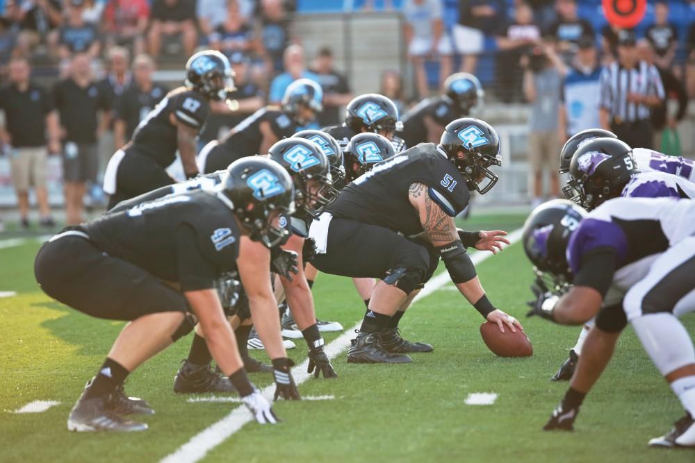 GVL / Kevin Sielaff 
Offensive lineman Aaron Cox (51) looks to hike the ball. Grand Valley State squares off against Southwest Baptist Thursday, September 3rd, 2015 at Lubbers Stadium. 