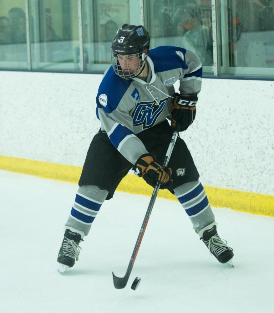 GVL / Kevin Sielaff - Danny Smith (3) juggles the puck in MSU's zone. The Lakers’ D3 men’s hockey team blows out Michigan State at Eagle Ice Center in Grand Rapids on Friday, February 12, 2016.