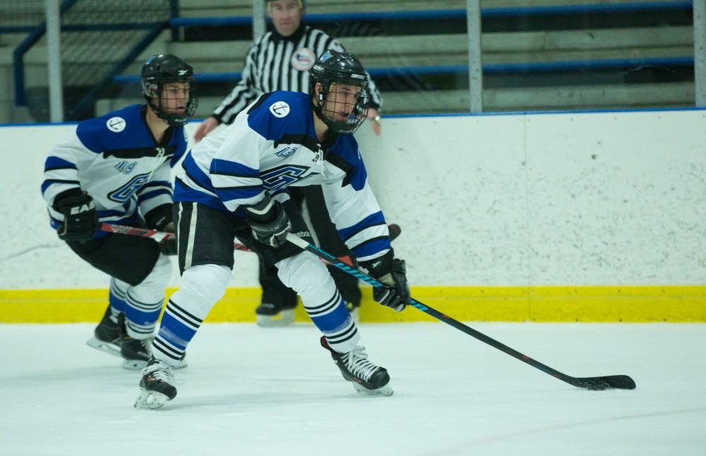 GVL / Kevin Sielaff - Tony Russo (13) carries the puck into Eastern's zone.  The Lakers defeat the Eagles of Eatern Michigan University Friday, Feb. 5, 2016 at Georgetown Ice Center.