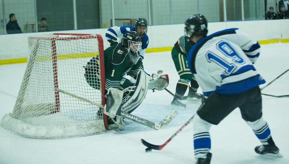 GVL / Kevin Sielaff - Collin Finkhouse (19) moves in on Eastern's net and looks to pass off the puck.  The Lakers defeat the Eagles of Eatern Michigan University Friday, Feb. 5, 2016 at Georgetown Ice Center.