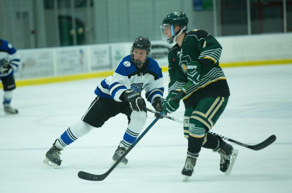 GVL / Kevin Sielaff - Troy Marrett (2) skates in Eastern's zone and looks to receive a pass.  The Lakers defeat the Eagles of Eatern Michigan University Friday, Feb. 5, 2016 at Georgetown Ice Center.