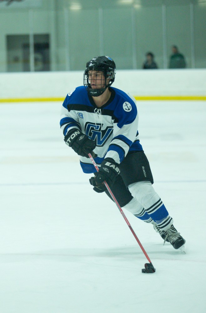 GVL / Kevin Sielaff - Collin Finkhouse (19) moves in toward Eastern's net.  The Lakers defeat the Eagles of Eatern Michigan University Friday, Feb. 5, 2016 at Georgetown Ice Center.