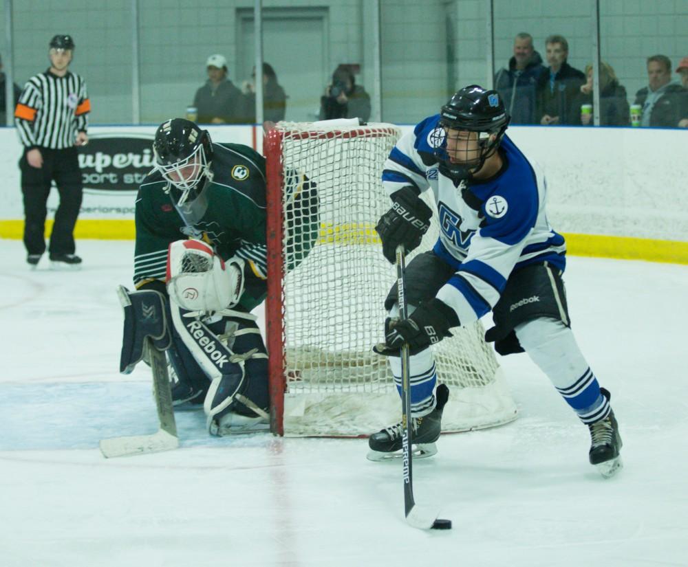 GVL / Kevin Sielaff - Nick Schultz (25) looks for a centering pass.  The Lakers defeat the Eagles of Eatern Michigan University Friday, Feb. 5, 2016 at Georgetown Ice Center.