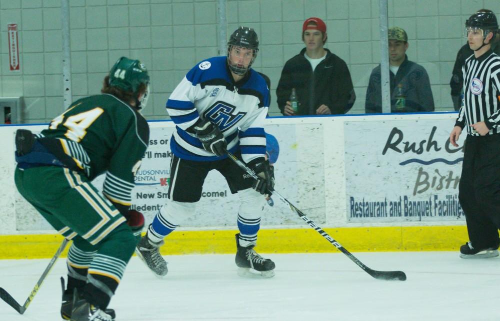 GVL / Kevin Sielaff - Troy Marrett (2) walks the puck up to the back line in Eastern's zone while looking to pass.  The Lakers defeat the Eagles of Eatern Michigan University Friday, Feb. 5, 2016 at Georgetown Ice Center.