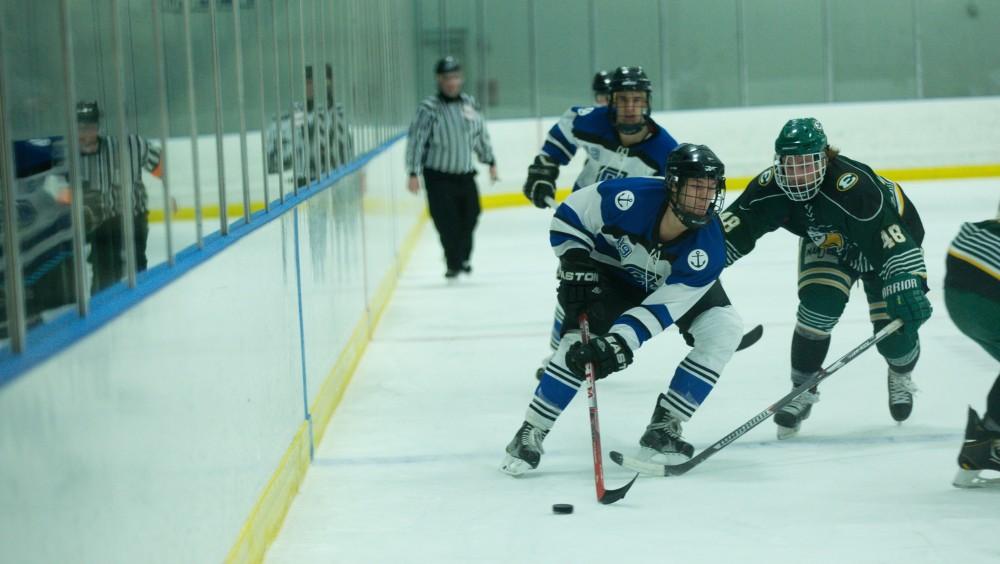 GVL / Kevin Sielaff - Collin Finkhouse (19) pushes the puck forward into Eastern's zone late in the third period.  The Lakers defeat the Eagles of Eatern Michigan University Friday, Feb. 5, 2016 at Georgetown Ice Center.