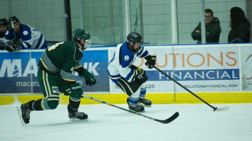 GVL / Kevin Sielaff - Mitch Claggett (10) carries the puck into Eastern's zone late in the third period and draws a penatly.  The Lakers defeat the Eagles of Eatern Michigan University Friday, Feb. 5, 2016 at Georgetown Ice Center.