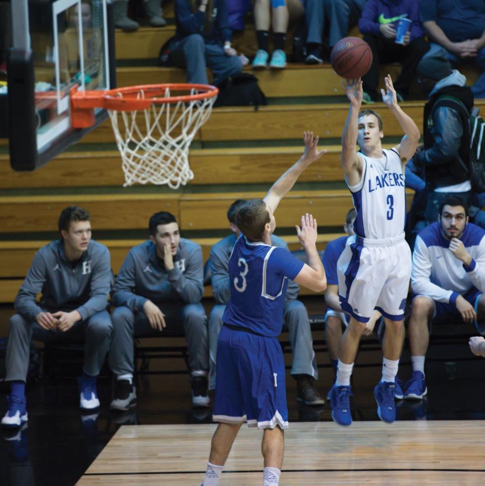 GVL / Kevin Sielaff - Darren Kapustka (3) tries a three point shot.  The Lakers defeat the Chargers of Hillsdale College Saturday, Jan. 30, 2016 in Allendale.