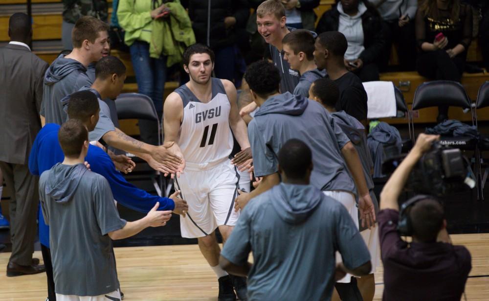 GVL / Kevin Sielaff - Zach West (11) heads onto the court before the match.  The Lakers defeat the Cardinals of SVSU with a final score of 76-73 in Allendale.