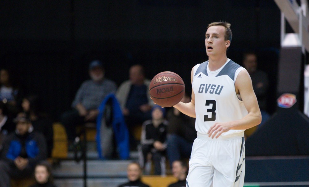 GVL / Kevin Sielaff - Darren Kapustka (3) dribbles the ball up the court. The Lakers defeat the Cardinals of SVSU with a final score of 76-73 in Allendale.