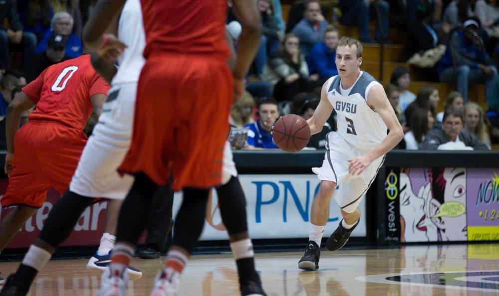 GVL / Kevin Sielaff - Darren Kapustka (3) drives the ball into the paint. The Lakers defeat the Cardinals of SVSU with a final score of 76-73 in Allendale.