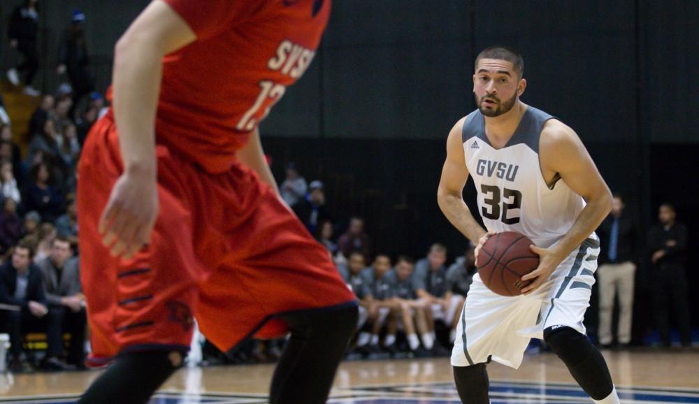 GVL / Kevin Sielaff - Ricardo Carbajal (32) swings the ball around the three point arc. The Lakers defeat the Cardinals of SVSU with a final score of 76-73 in Allendale.