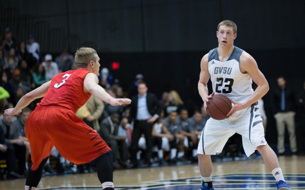 GVL / Kevin Sielaff - Luke Ryskamp (23) picks up his dribble and looks to pass. The Lakers defeat the Cardinals of SVSU with a final score of 76-73 in Allendale.