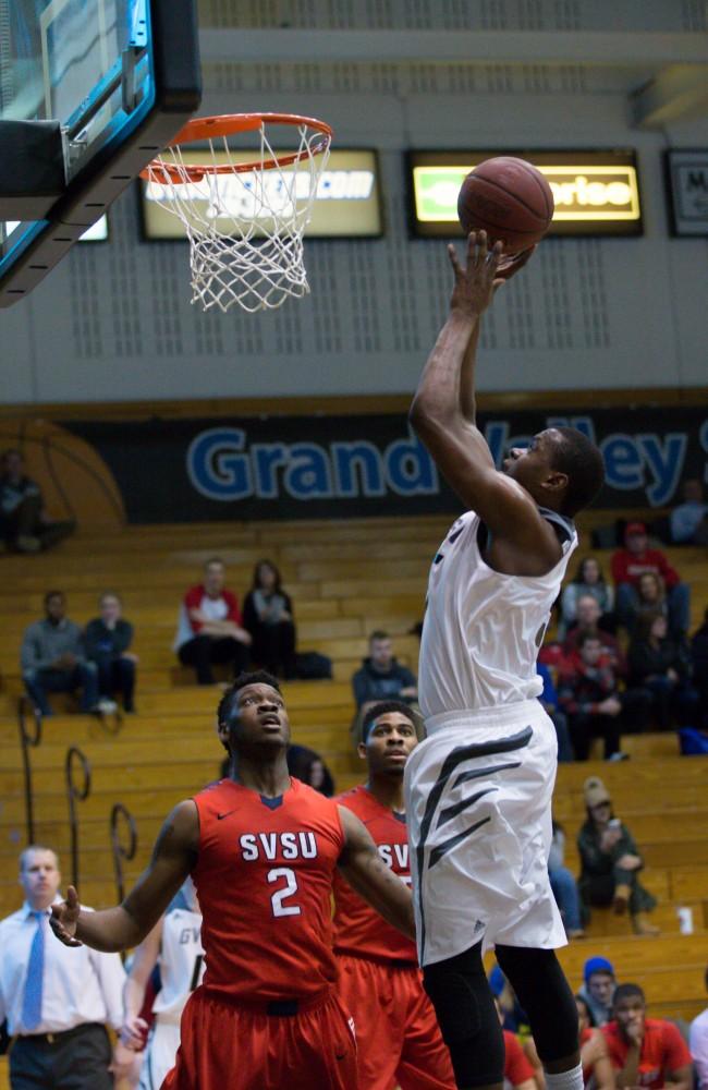 GVL / Kevin Sielaff - Trevin Alexander (5) tries a shot at close range. The Lakers defeat the Cardinals of SVSU with a final score of 76-73 in Allendale.