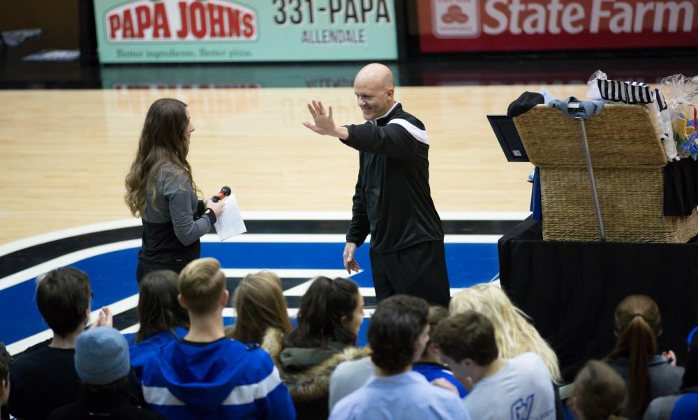 GVL / Kevin Sielaff - Tim Selgo is honored at half time by GVSU athletes. The Lakers defeat the Cardinals of SVSU with a final score of 76-73 in Allendale.