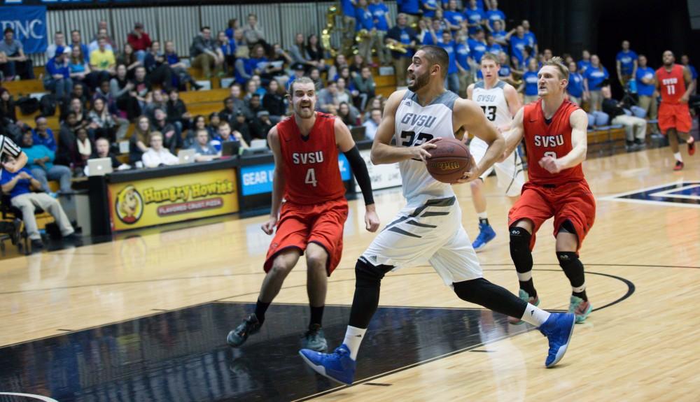 GVL / Kevin Sielaff - Ricardo Carbajal (32) goes in for the easy layup. The Lakers defeat the Cardinals of SVSU with a final score of 76-73 in Allendale.