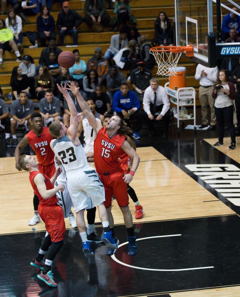 GVL / Kevin Sielaff - Luke Ryskamp (23) tries a short jump shot. The Lakers defeat the Cardinals of SVSU with a final score of 76-73 in Allendale.