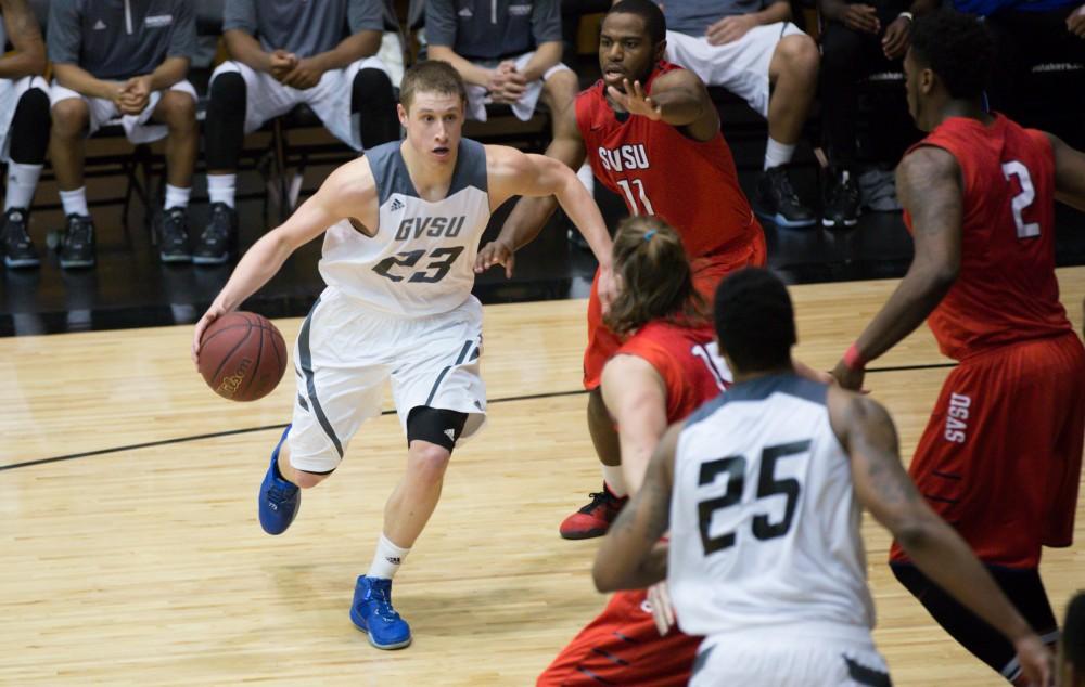 GVL / Kevin Sielaff - Luke Ryskamp (23) drives the ball toward the hoop. The Lakers defeat the Cardinals of SVSU with a final score of 76-73 in Allendale.