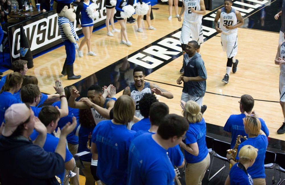 GVL / Kevin Sielaff - The Grand Valley victory is celebrated by both the pep band and the members of the men's basketball team. The Lakers defeat the Cardinals of SVSU with a final score of 76-73 in Allendale.