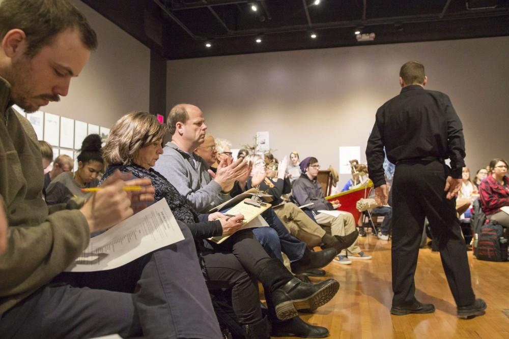 GVL / Sara Carte - The audience claps at the end of the performance at the New Music Ensemble Student Competition in the Performing Arts Center on Thursday, Feb. 25, 2016.