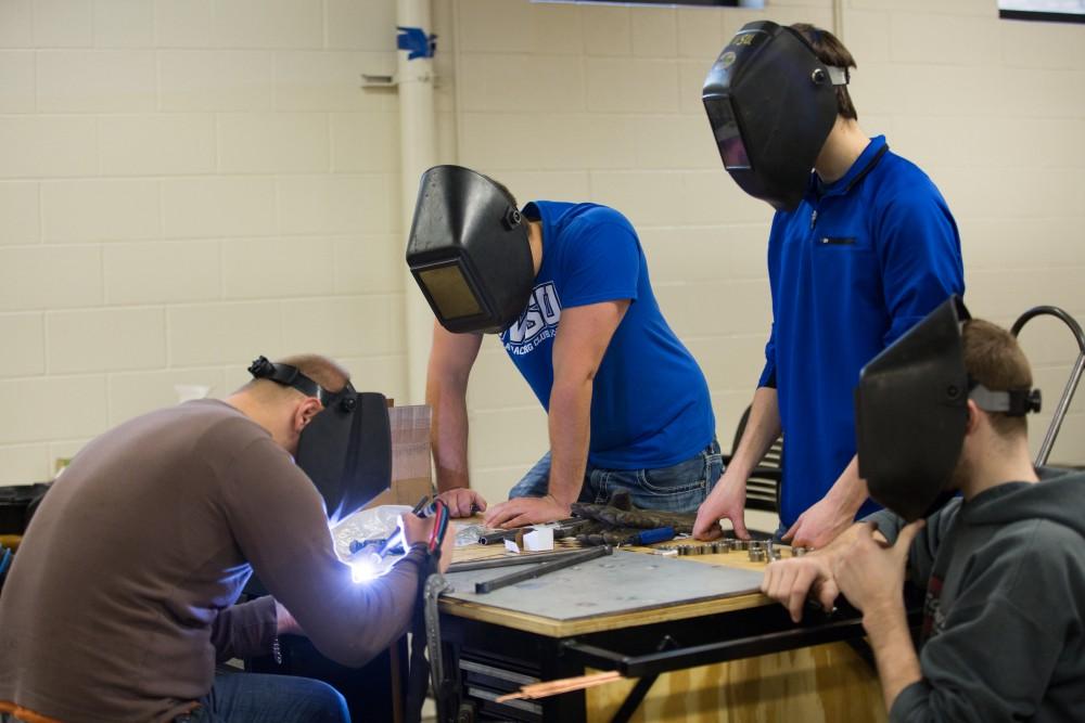 GVL / Kevin Sielaff - A-arms are assembled by members of the GVSU Formula SAE racing team Saturday, Feb. 27, 2016 inside the vehicle bay at Grand Valley’s John C. Kennedy Hall of Engineering.