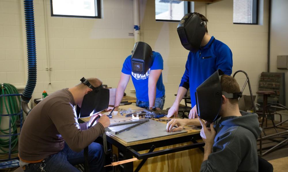 GVL / Kevin Sielaff - A-arms are assembled by members of the GVSU Formula SAE racing team Saturday, Feb. 27, 2016 inside the vehicle bay at Grand Valley’s John C. Kennedy Hall of Engineering.