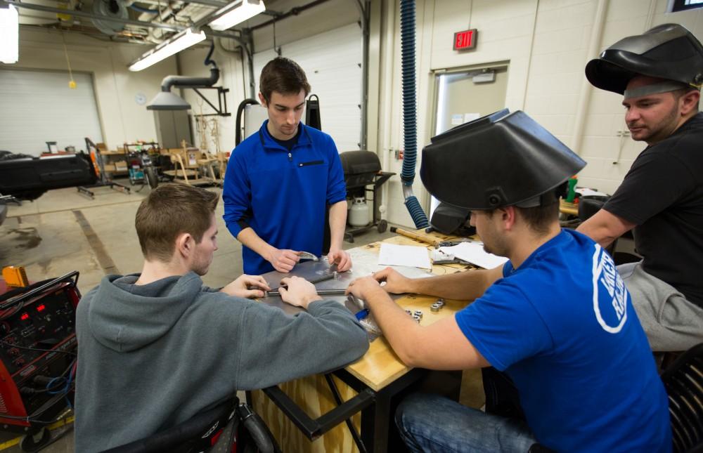 GVL / Kevin Sielaff - A-arms are assembled by members of the GVSU Formula SAE racing team Saturday, Feb. 27, 2016 inside the vehicle bay at Grand Valley’s John C. Kennedy Hall of Engineering.