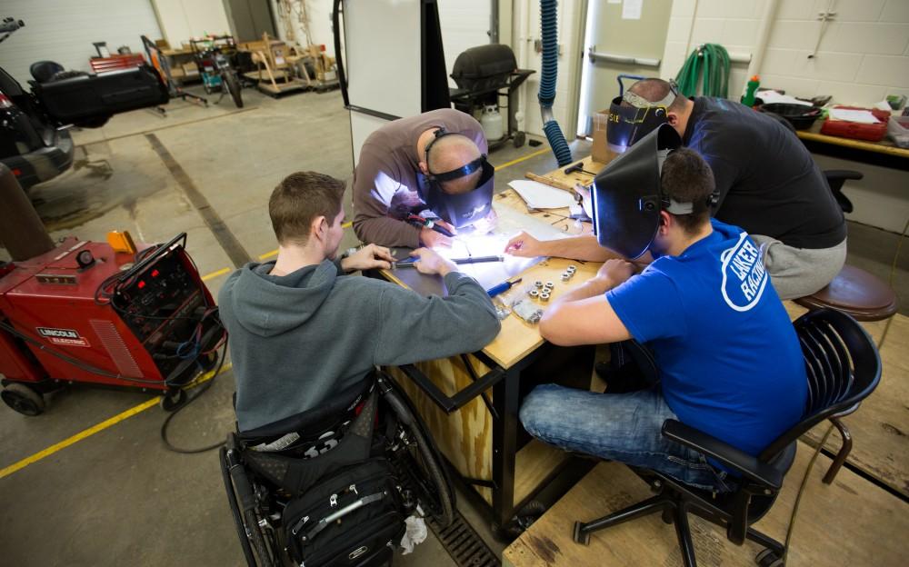 GVL / Kevin Sielaff - A-arms are assembled by members of the GVSU Formula SAE racing team Saturday, Feb. 27, 2016 inside the vehicle bay at Grand Valley’s John C. Kennedy Hall of Engineering.