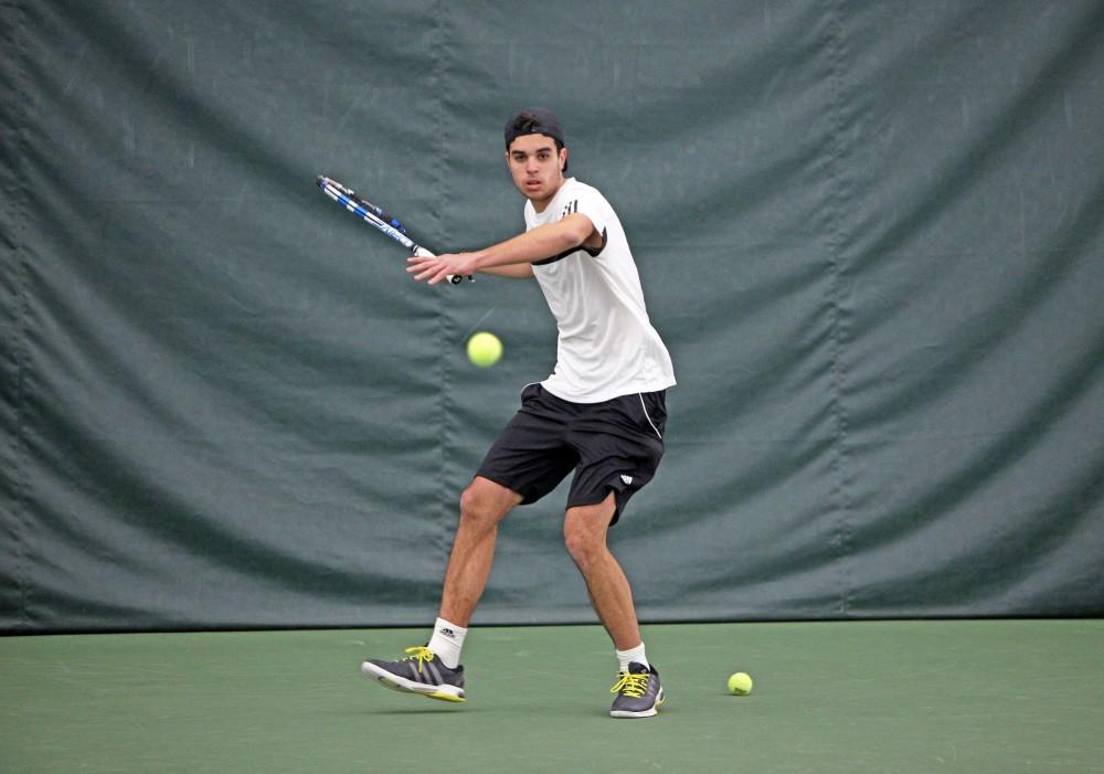 GVL / Emily Frye 
Freshman Pedro Gomez gets ready to return the serve on Feb. 14, 2016. 