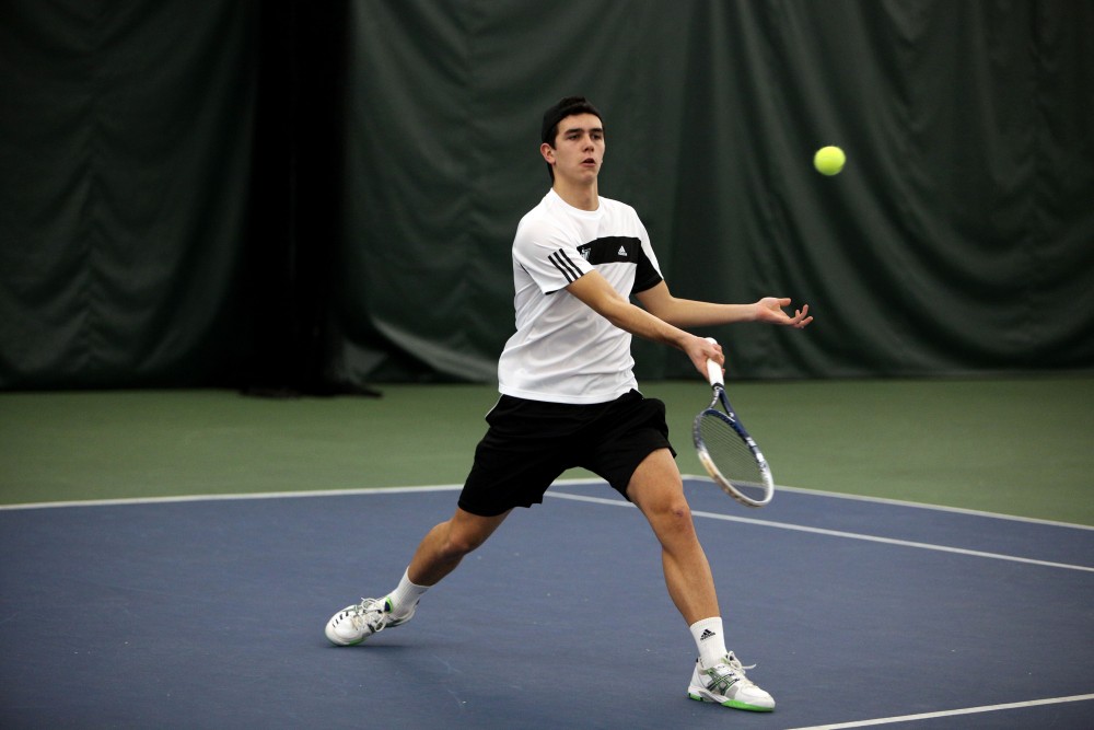 GVL / Emily Frye 
Freshman Marcus Muniz Infante warms up for his match against Davenport University on Friday Feb. 19, 2016.