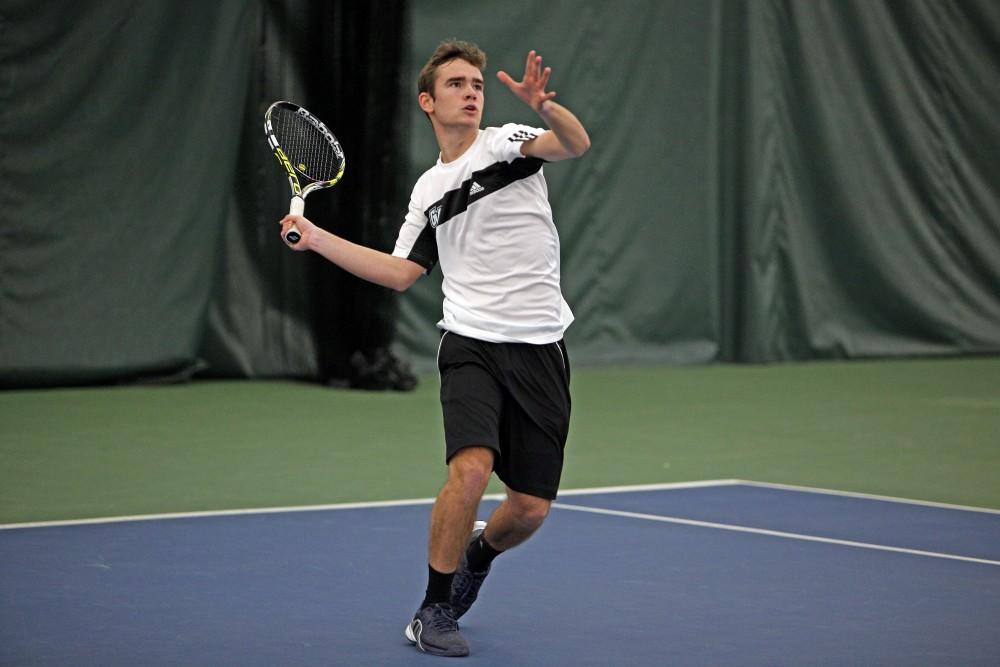 GVL / Emily Frye 
Freshman Marcus Muniz Infante warms up for his match against Davenport University on Friday Feb. 19, 2016.