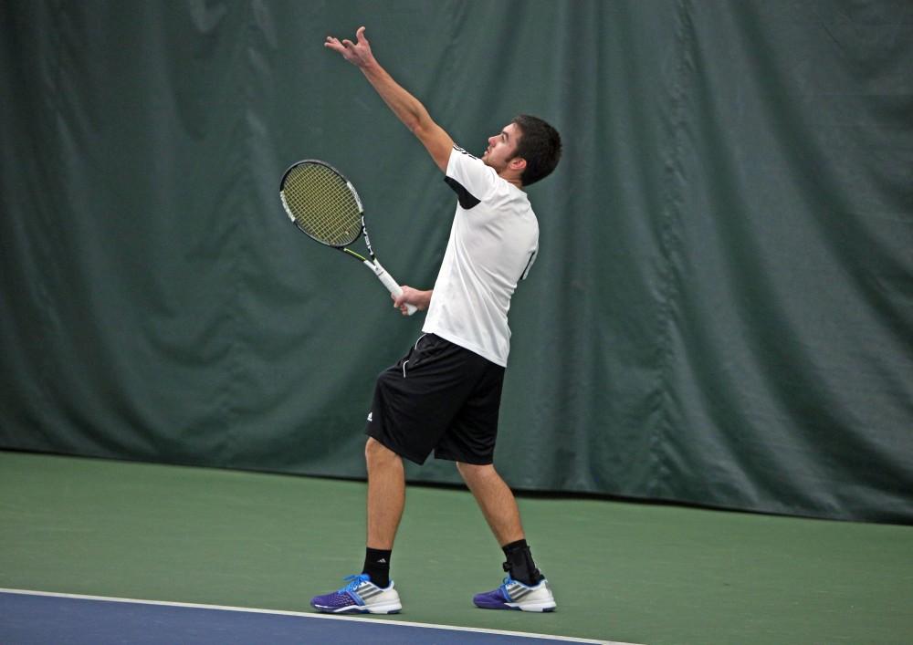 GVL / Emily Frye 
Senior Michael Kaye returns the serve against Davenport University on Friday Feb. 19, 2016.