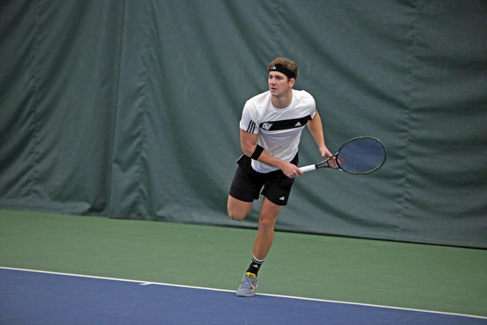 GVL / Emily Frye 
Junior Zach Phillips serves the ball during a match against Daemen College on Feb. 14, 2016.