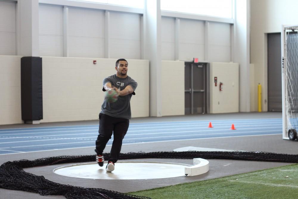 Darien Thornton practices his shot put on Feb.4 in Allendale, MI. 
