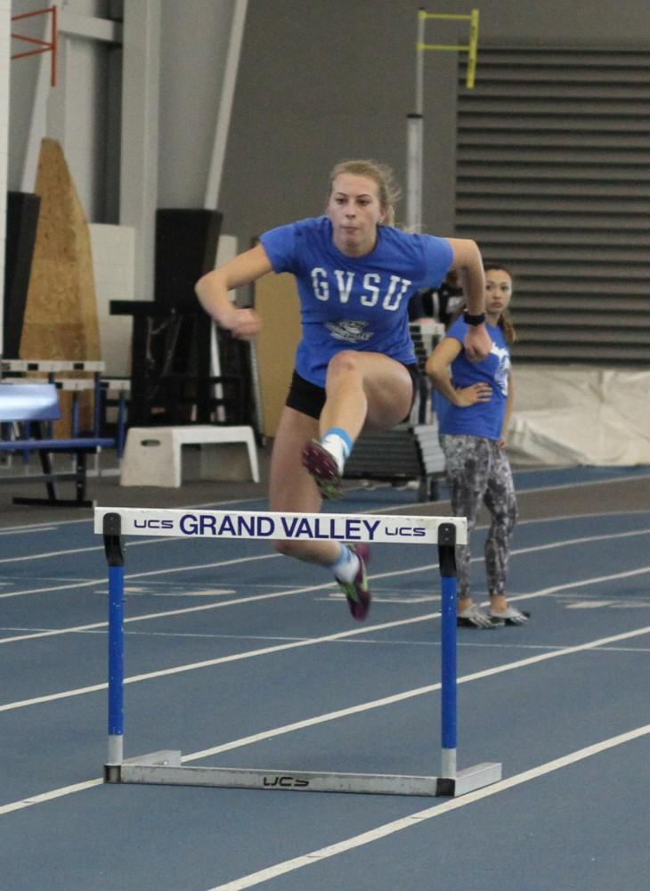 Grace Peterson jumps hurtles while at track practice on Feb. 4 in Allendale, MI. 