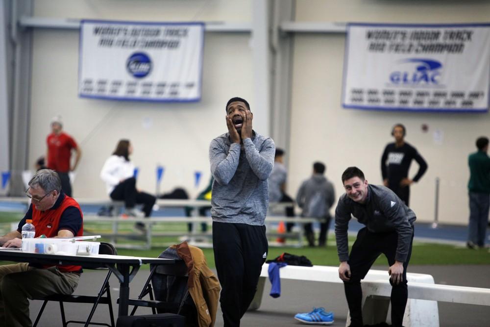 GVL / Emily Frye
Junior Brandon Bean gets emotional when his teammate successfully completes the high jump on Friday, Feb. 19, 2016.