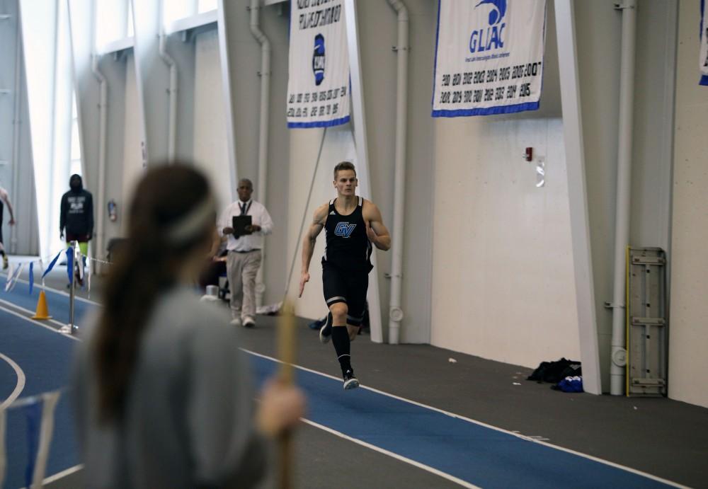 GVL / Emily Frye
R-Freshman Kyle Sawyer races towards the long jump on Friday, Feb. 19, 2016.