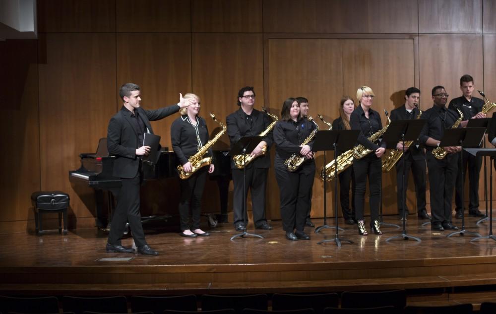 GVL / Kevin Sielaff - The GVSU Saxophone Ensemble plays two pieces, Aurora (composed by Hans Zimmer), and Sleep (composed by Eric Whitacre). The Alex Aninos Scholarship Recital is held Friday, March 25, 2016 inside Grand Valley's Cook-DeWitt Center in Allendale. 