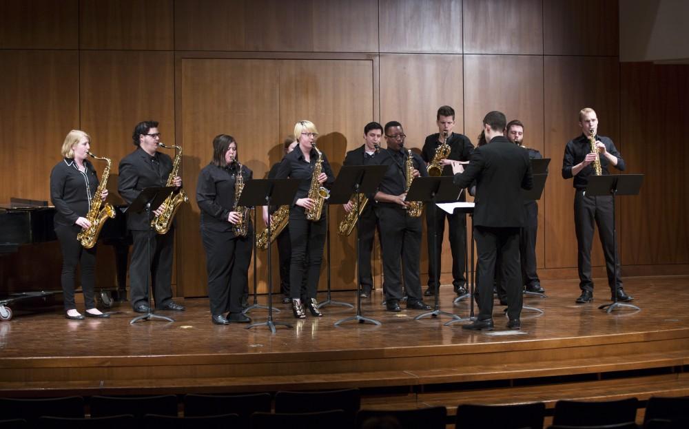 GVL / Kevin Sielaff - The GVSU Saxophone Ensemble plays two pieces, Aurora (composed by Hans Zimmer), and Sleep (composed by Eric Whitacre). The Alex Aninos Scholarship Recital is held Friday, March 25, 2016 inside Grand Valley's Cook-DeWitt Center in Allendale. 