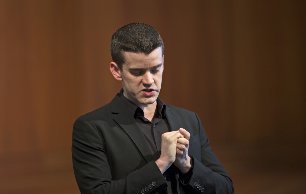 GVL / Kevin Sielaff - Dr. Daniel Graser gives his opening remarks before the start of the concert. The Alex Aninos Scholarship Recital is held Friday, March 25, 2016 inside Grand Valley's Cook-DeWitt Center in Allendale. 