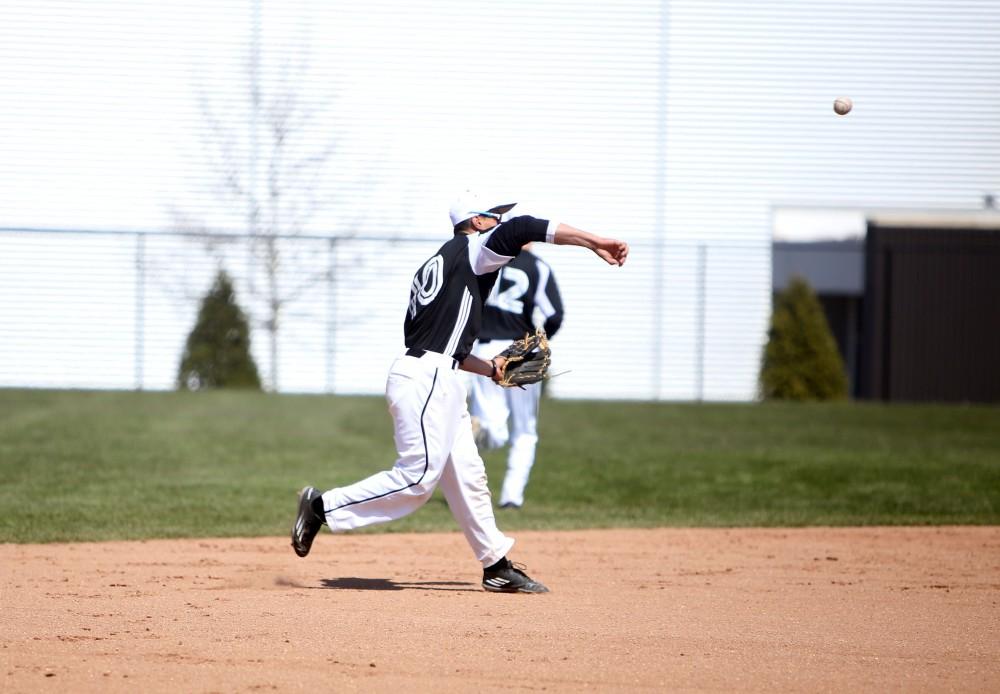 GVL / Emily Frye 
Infielder Johnny Nate makes a play at first base against Saginaw Valley State University on Saturday Mar. 26, 2016. 