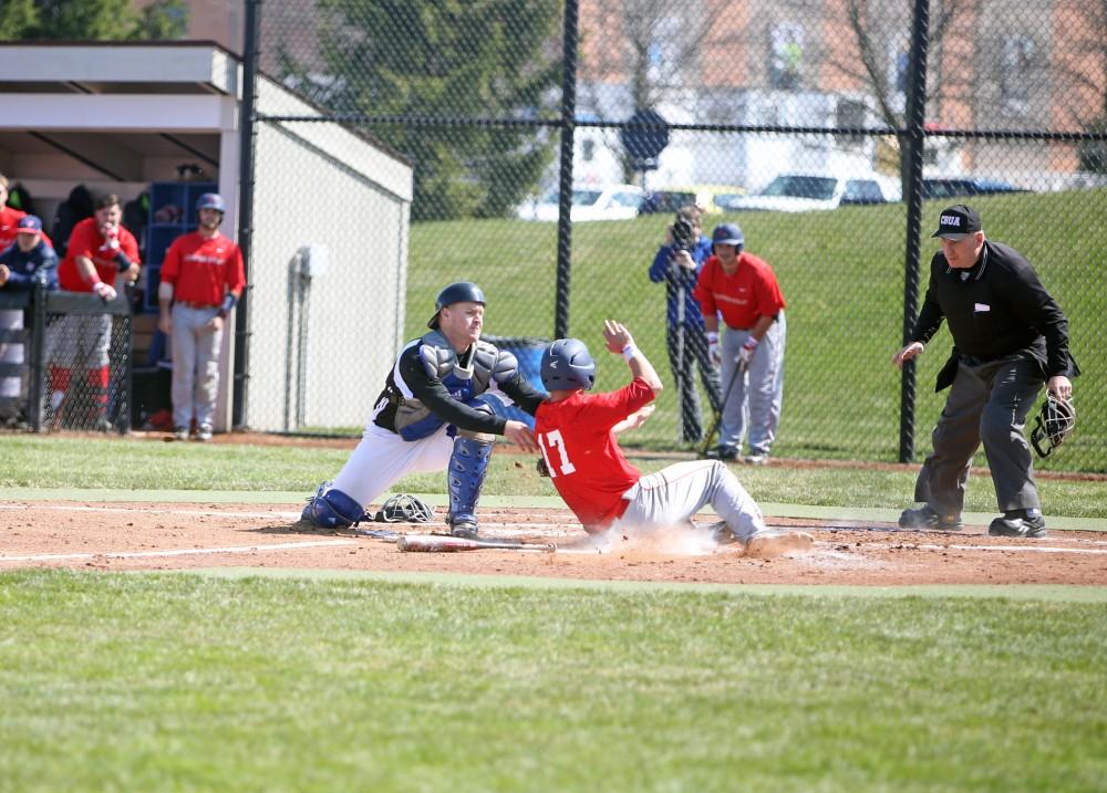 GVL / Emily Frye 
Catcher Brody Andrews makes the tag at home plate against Saginaw Valley State University on Saturday Mar. 26, 2016. 